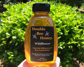 Picture of fresh, raw wildflower honey in a squeeze bottle by Double Bee Honey, LLC in Suwanee, Georgia 30024.  16oz. 